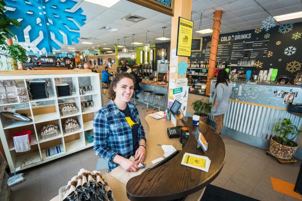 A host greets visitors at the front desk of Snow City Cafe
