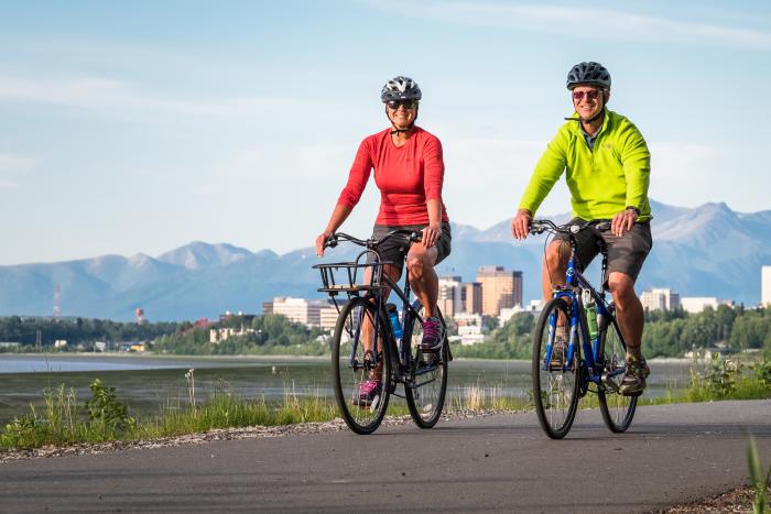 Biking along the Coastal Trail in view of downtown.