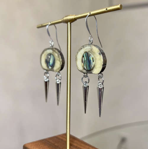 Image of earrings made out of moose antler and abalone with sterling silver hooks.