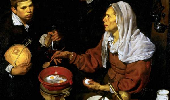 Vieja friendo huevos