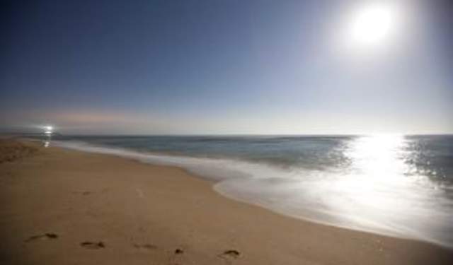 Sun over beach