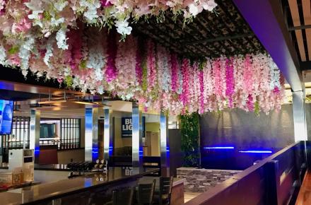 Hanging flowers waterfall interior bar seating