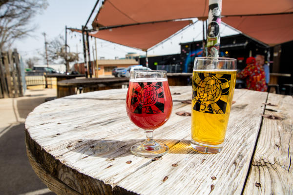 Division Brewing beers on table in the back patio
