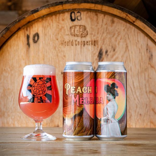 Photo of glass of beer and can of beer at Division Brewing