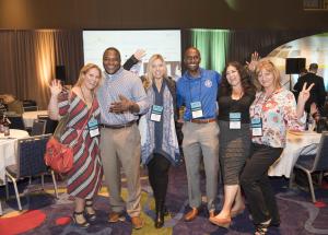 A group of people pose for the camera.
