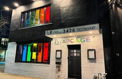 Front entrance of the Byrdcage Restaurant and Bar with rainbow transluscent windows and Byrdcage signage. 3426 Atlantic Avenue Atlantic City, NJ.
