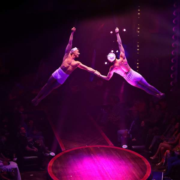 Two men dangle high above the audience at The Hook live show inside the historic Warner Theatre at Caesars Atlantic City.