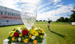 A crystal vase surrounded by flowers on a pedestal as a LPGA Golf Professional tees off at the ShopRite LPGA at Seaview Hotel & Golf Club in Galloway, NJ.