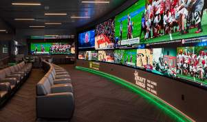 Chairs in front of screens showing sports events