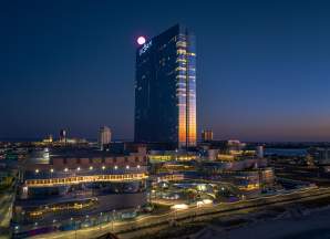 Ocean Casino Resort and Boardwalk with sunrise reflected off of tower.