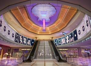 Hard Rock Hotel & Casino atrium with iconic guitar chandelier hanging over the main escalators.