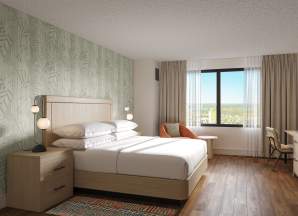 Refreshed King Room décor in the new Solana Tower at Tropicana Atlantic City. Sleek wood style flooring mixed with soft neutrals and earthy hues of blues and greens.