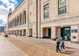 People Walking Down The Atlantic City Boardwalk