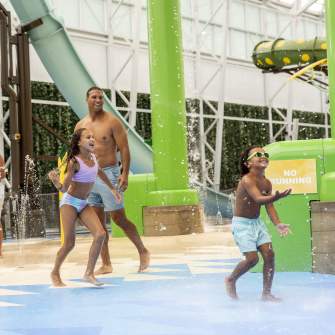 Dad watches his two young kids splash around at Island Waterpark at Showboat Resort, Atlantic City.