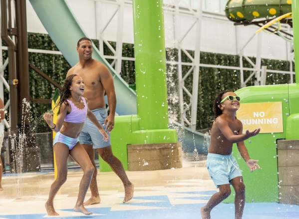 Dad watches his two young kids splash around at Island Waterpark at Showboat Resort, Atlantic City.