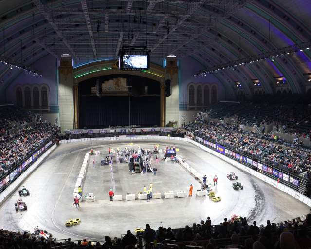 Indoor Auto Racing at Jim Whelan Boardwalk Hall arena with race cars.
