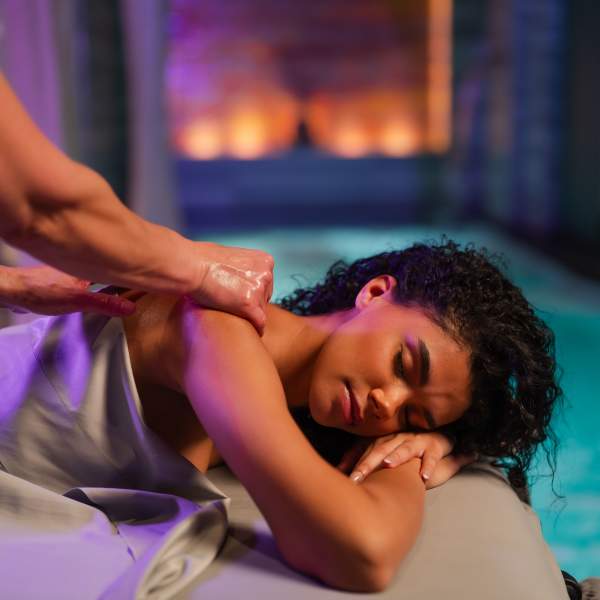 Woman receives a massage in the relaxing grotto of Exhale Spa at Ocean Casino Resort in Atlantic City.