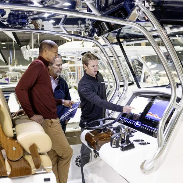 Attendees view boat controls demo on the show floor at the Discover Boating Atlantic City Boat Show.