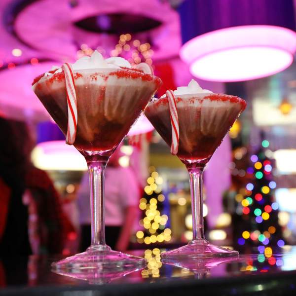 Holiday themed cocktails with candy cane garnish at Resorts pop-up holiday themed Candy Cane Lounge at Bar One.