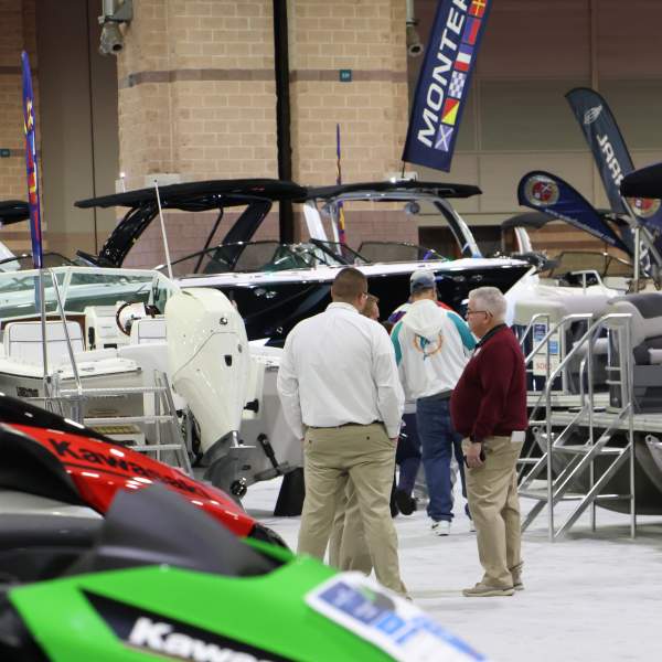 People browsing and talking about boats and jetski's at the Discover Boating Atlantic City Boat Show.