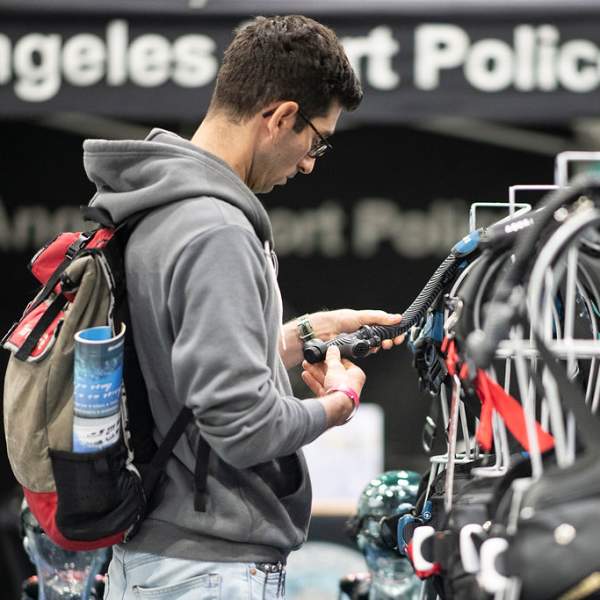 Scuba Show Attendee browsing the show floor for the latest gear.