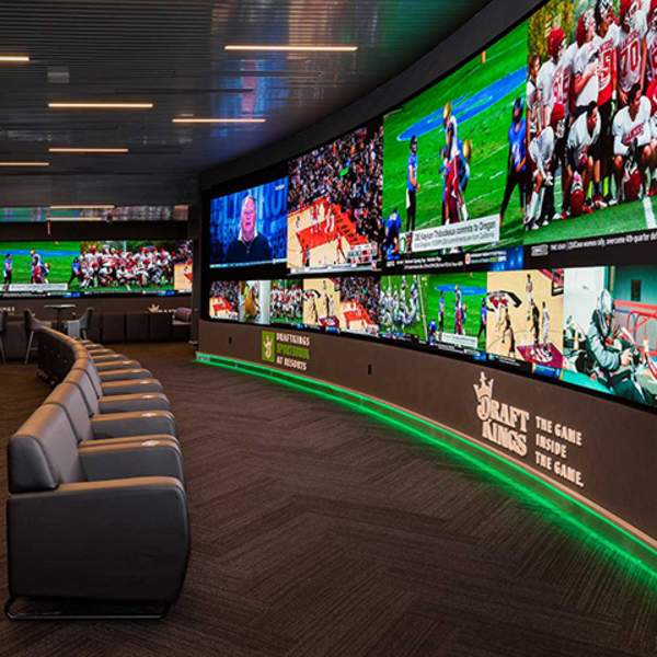 Chairs in front of screens showing sports events