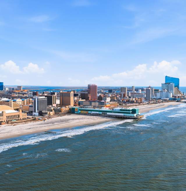 Aerial view of Atlantic City, NJ with Atlantic Ocean and Shoreline in view during the day.