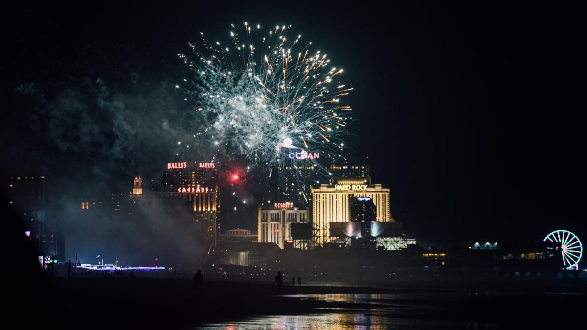 Fireworks at night in Atlantic City from beach and Boardwalk.