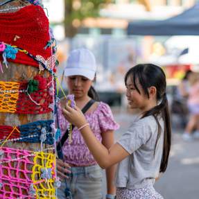 Girls Shopping at Booths at Arts in the Heart Festival