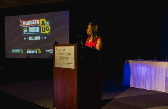 Emcee at Augusta State of Tourism with Logo Slide