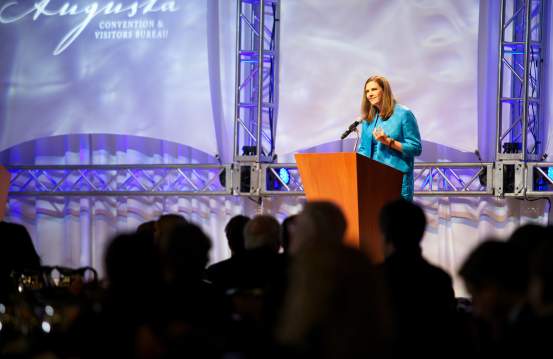 Lady Speaker at a Meeting