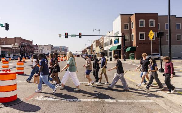 Group of Students Walking Downtown During Construction