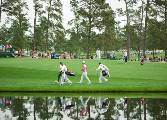 Golfer and Caddie Walking Across Pond | Masters