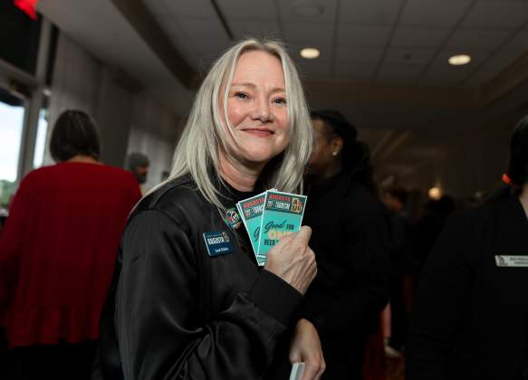 Sarah Holding Tickets at Augusta State of Tourism 2024
