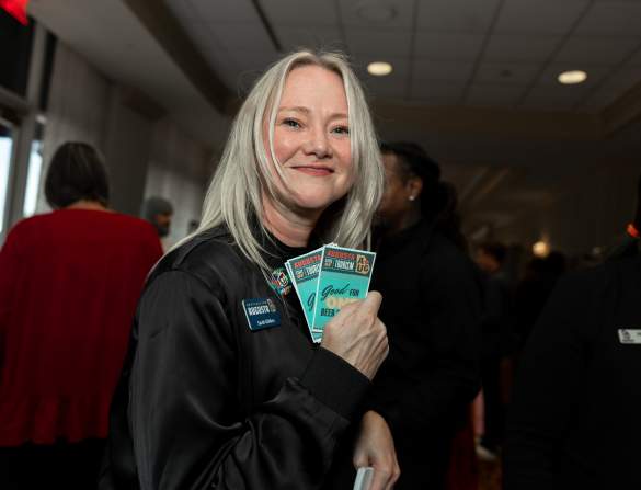 Sarah Holding Tickets at Augusta State of Tourism 2024