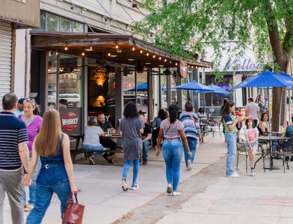 Photo of people walking in Downtown Augusta on Broad Street.