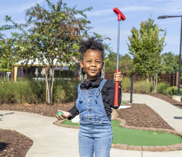 Kid Playing Putt-Putt at Topgolf Augusta
