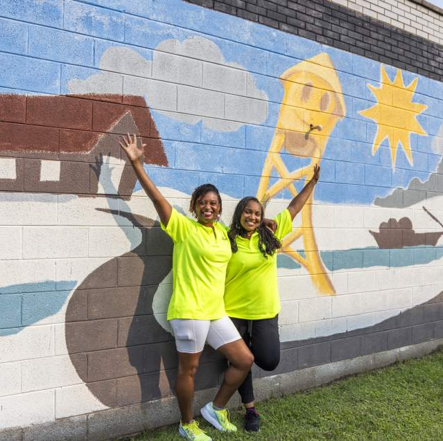 Franshetta & Lakeisha in front of mural