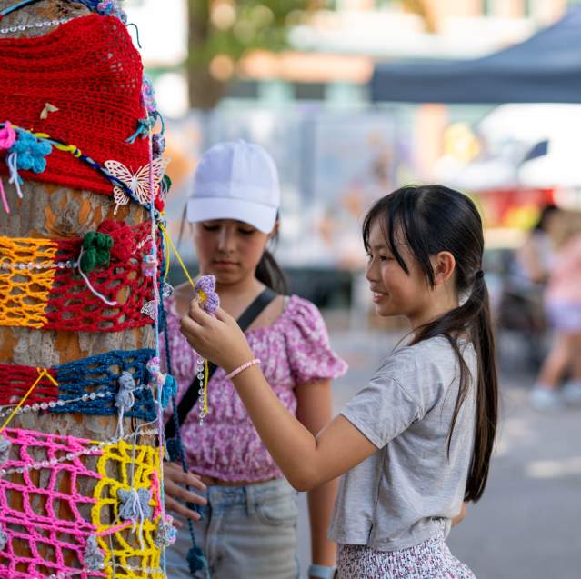 Girls Shopping at Booths at Arts in the Heart Festival