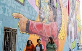 Women at James Brown Mural in Downtown
