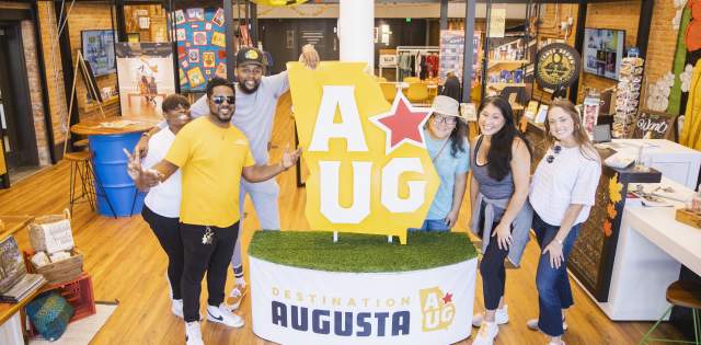 Augusta & Co. Pose with AUG Star Icon