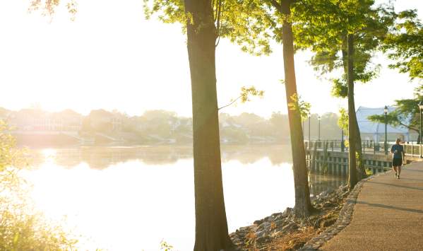 Man Jogging Along The Augusta Riverwalk