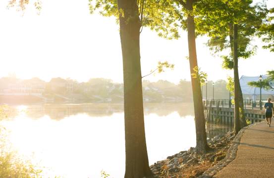 Man Jogging Along The Augusta Riverwalk