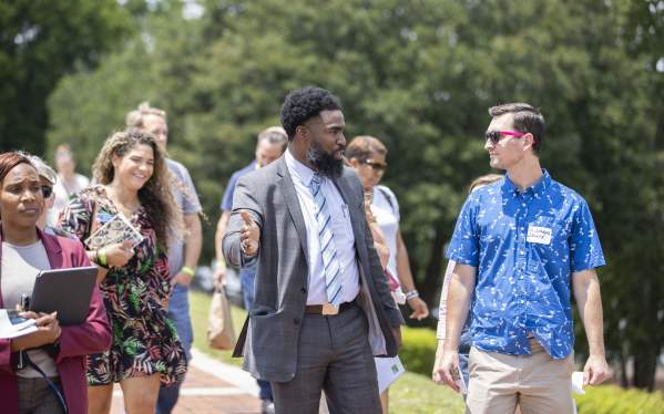 Group of conference attendees walking on the Augusta Riverwalk