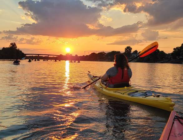 People Kayaking At Sunset On The Savannah River