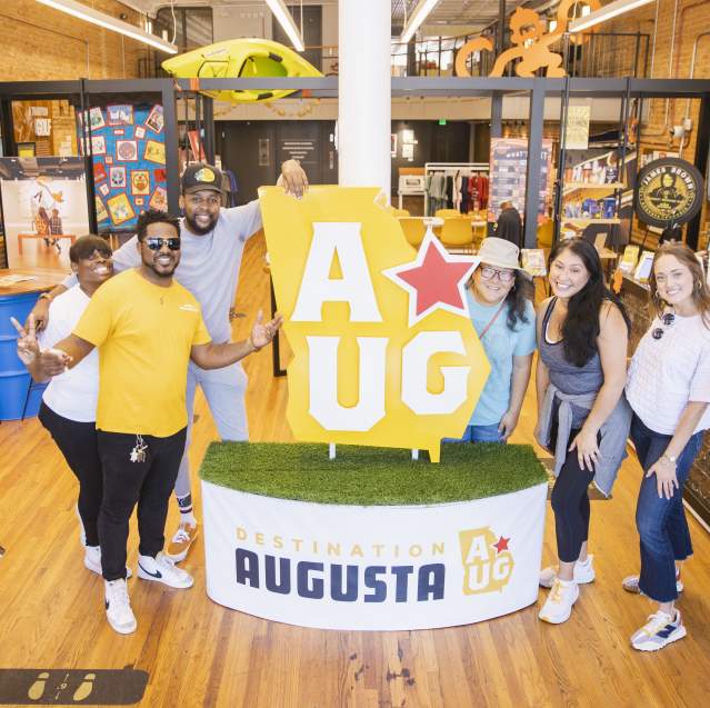 Augusta & Co. Pose with AUG Star Icon