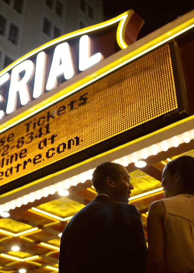 Couple in Front of Imperial Theatre Marquee