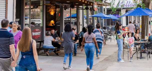 Photo of people walking in Downtown Augusta on Broad Street.