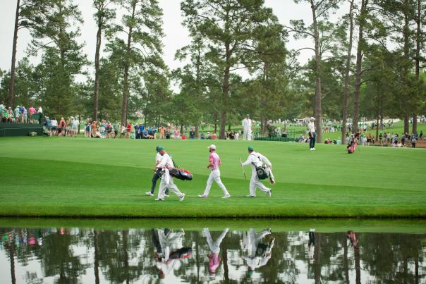 Golfer and Caddie Walking Across Pond | Masters