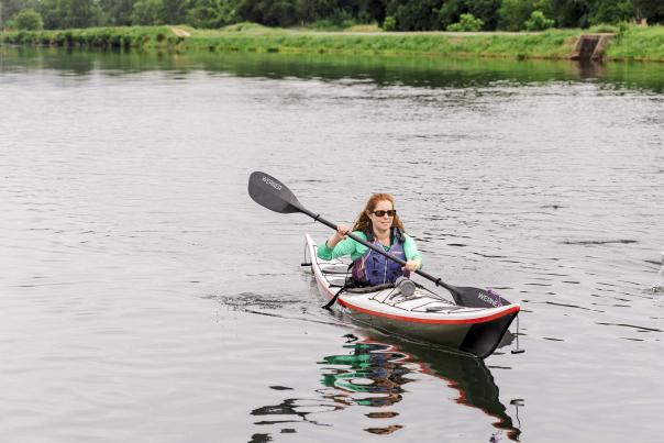 Woman Kayaking along the Augusta Canal in Summer